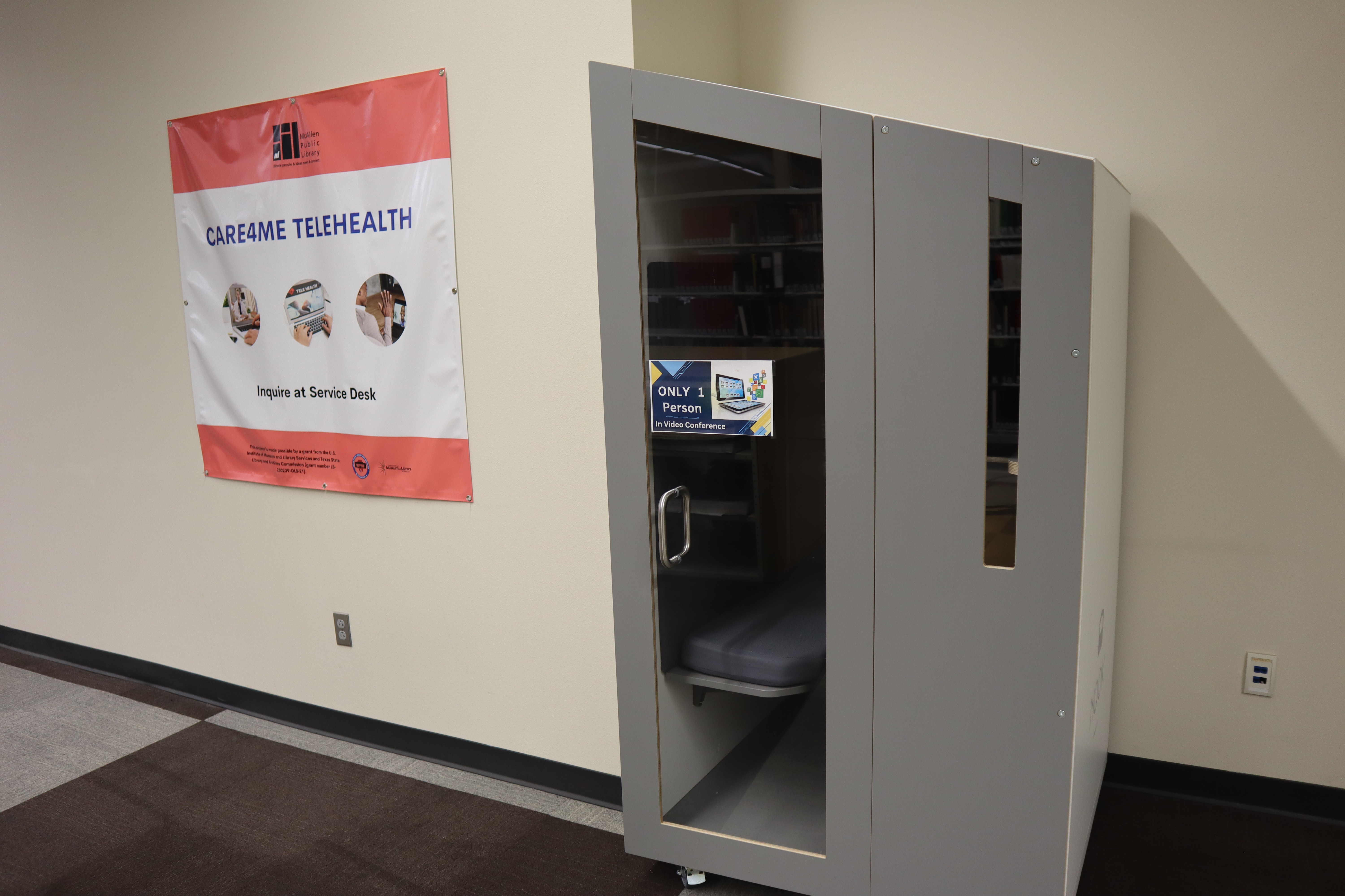 Private video conferencing booth at Main Library available for virtual meetings, interviews, telehealth appointments, and online classes.