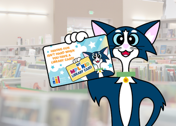 Marty holding a Library Card